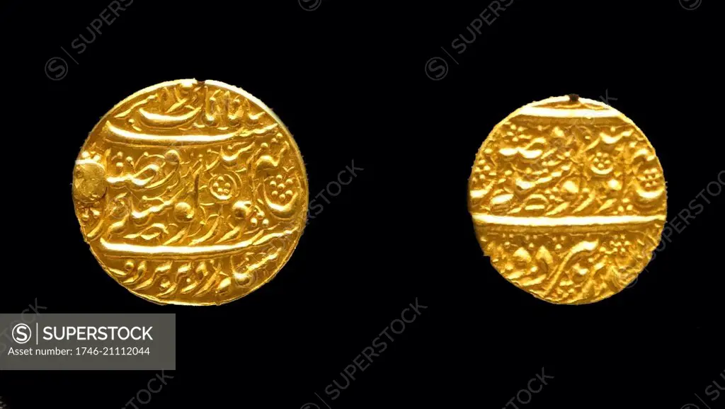 Gold Sikh coins, Amritsar (India), 1826 and 1827, issued by Maharaja Ranjit Singh. The Sikhs continued to use Persian as the official state language and their coins show ornate Persian couplets. The inscriptions on Sikh coins mention Guru Nanak and Guru Gobind Singh, the first and tenth Sikh gurus, on the front