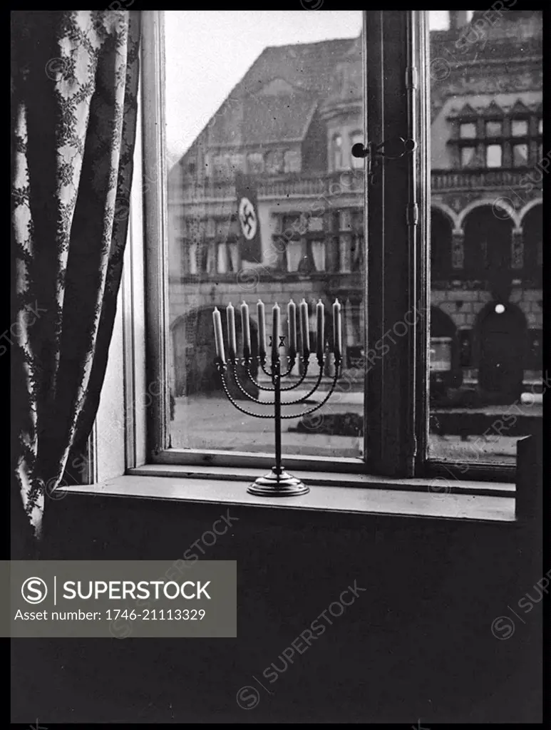 Photograph of a Jewish menorah on a window ledge in Nazi Germany. Dated 1931