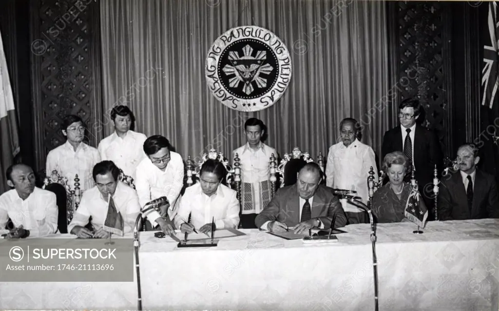 president Ferdinand Marcos and New Zealand Prime Minister Robert Muldoon signing energy agreement, Malacanang Palace, Manilla, Philippines 1980.