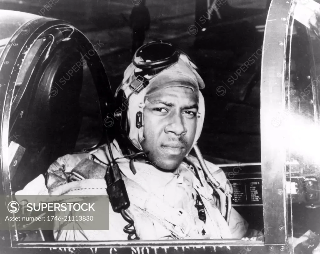 Ensign Jesse L. Brown, seated in the cockpit of an F4U-4 Corsair Fighter plane, the U.S. Navyís first black naval aviator. While in Korea, he was killed in action and posthumously awarded the Distinguished Flying Cross.