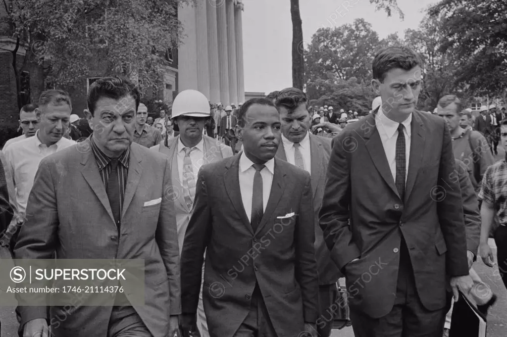 James Meredith (African-American student) walking to class following de-segregation, accompanied by U.S. marshals missisippi univ 1968