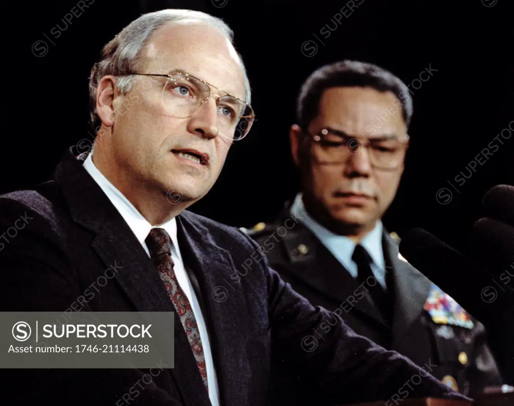 Photograph of Secretary of Defense Dick Cheney (1941-) and Secretary of State Colin Powell (1937-). Dated 1991