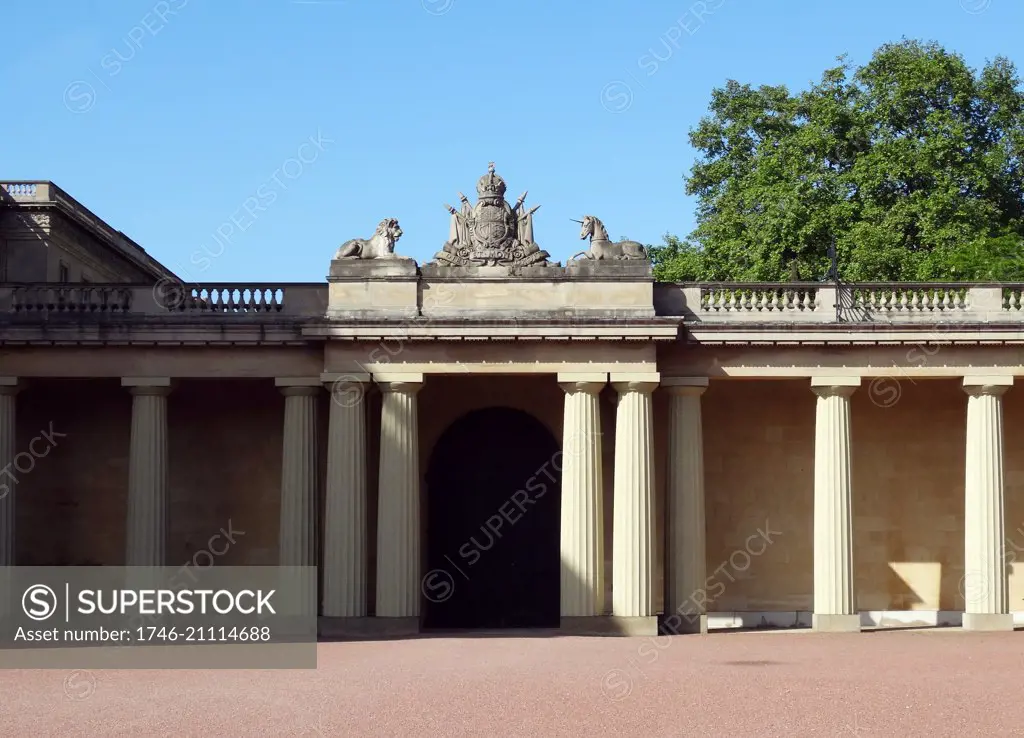 Royal Crest with lion and Unicorn adorn a courtyard inside Buckingham Palace, London, England