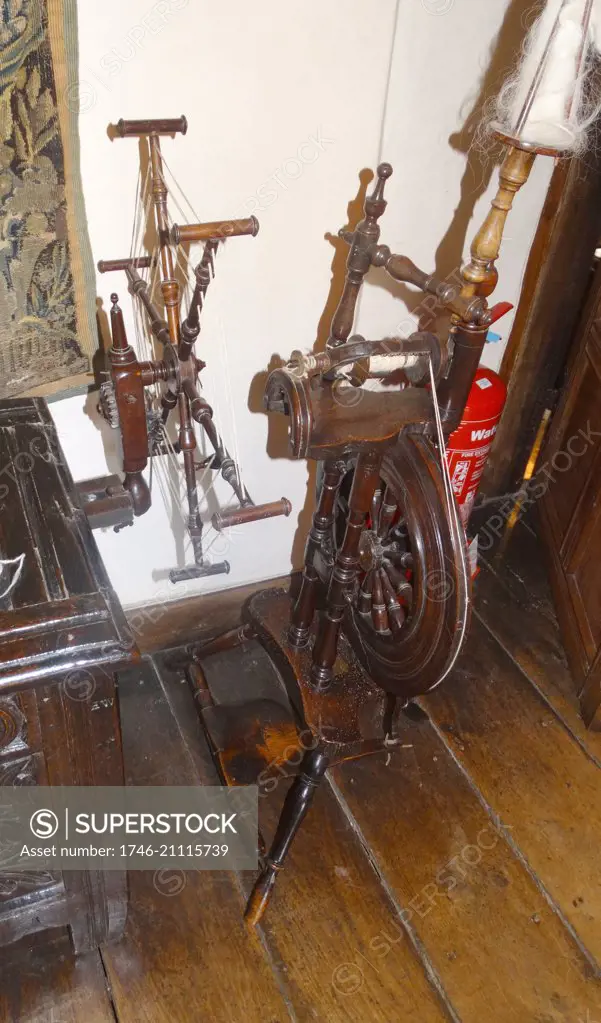 17th century period spinning wheel for spinning wool, at Sulgrave Manor, England, ancestral home of George Washington. 2015