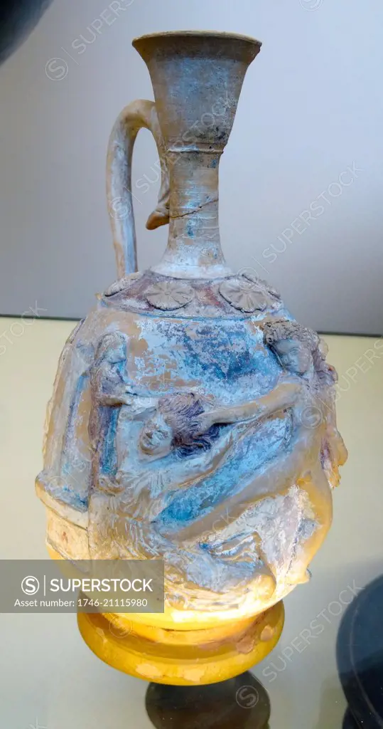 Ancient squat lekythos with relief decoration showing Neoptolemos seizing Kassandra at the altar of Athena at Troy. Made in Apulia. Dated 330 BC.