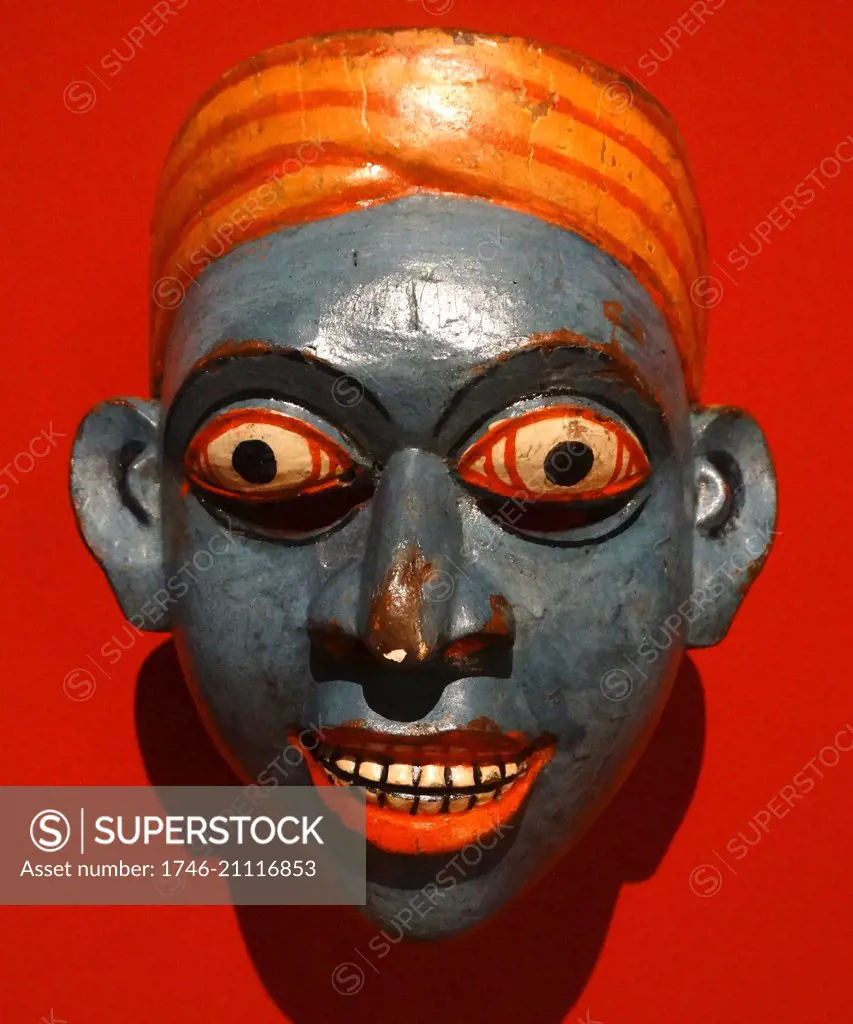 Disease mask. Used in Singhalese healing rituals to exorcise demons that were believed to have been causing illnesses. Possibly used to treat diarrhoea. Made from painted wood, Sri Lanka, 19th Century.