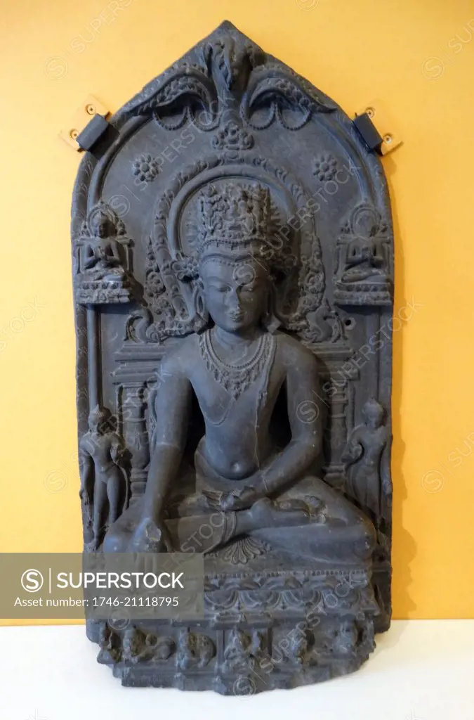 Sculpture depciting a Crowned Seated Buddha from the Pala period. Bihar, India. Dated 11th Century