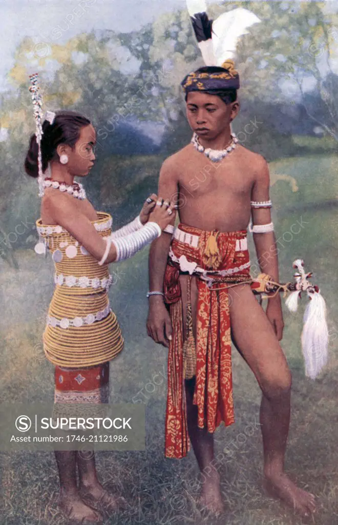 Young Ibans (Sea Dayaks),in formal tribal costume 1922. Dayak is a term for over 200 riverine and hill-dwelling ethnic subgroups, located principally in the interior of Borneo, each with its own dialect, customs, laws, territory and culture,