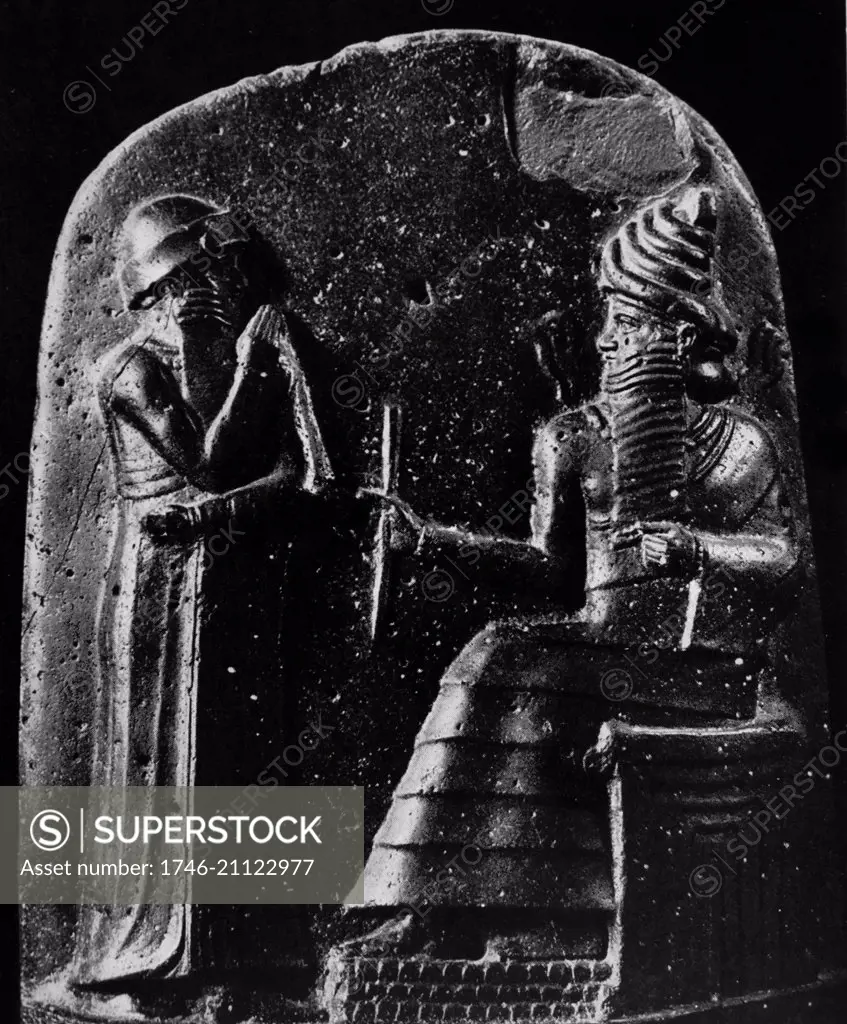 Detail from the stele of Hammurabi showing the king receiving royal insignia from Shamash. Hammurabi was the 6th king of the 1st Babylonian dynasty. Dated 1792-1750 BC