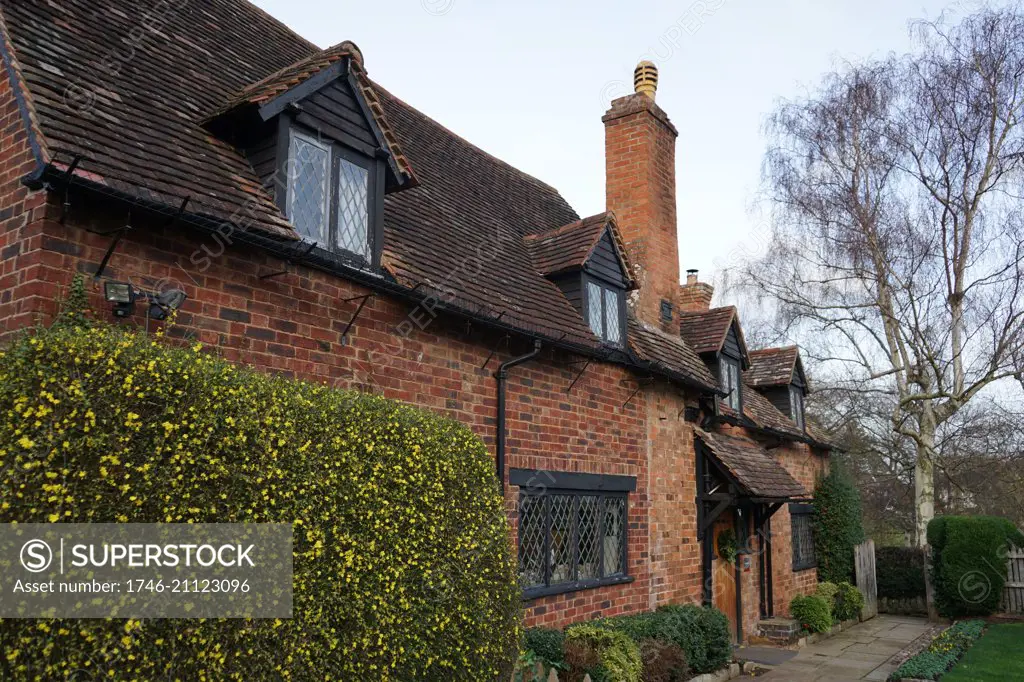 Anne Hathaway's Cottage, where Anne Hathaway, the wife of William Shakespeare, lived as a child. Stratford-upon-Avon, England. The earliest part of the house was built prior to the 15th century; the higher part is 17th century