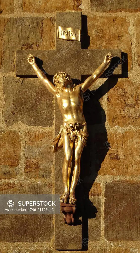 War memorial with Gilded figure of Christ on a cross; Middleton Cheney, Oxfordshire, England