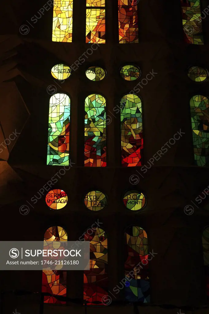 Stained glass window at the BasÌlica i Temple Expiatori de la Sagrada FamÌlia, a Roman Catholic church in Barcelona, designed by Spanish architect Antoni GaudÌ (1852ñ1926). Dated 21st Century