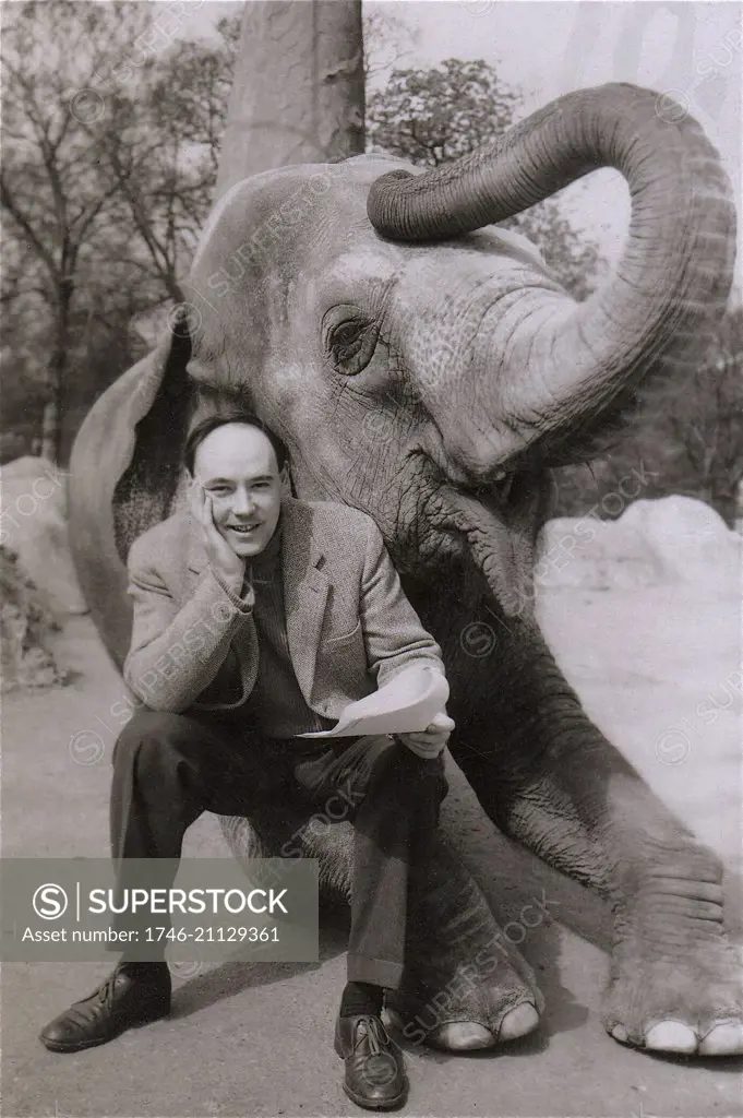 Desmond Morris at the London Zoo with an elephant for Granada TV's Zootime progamme.