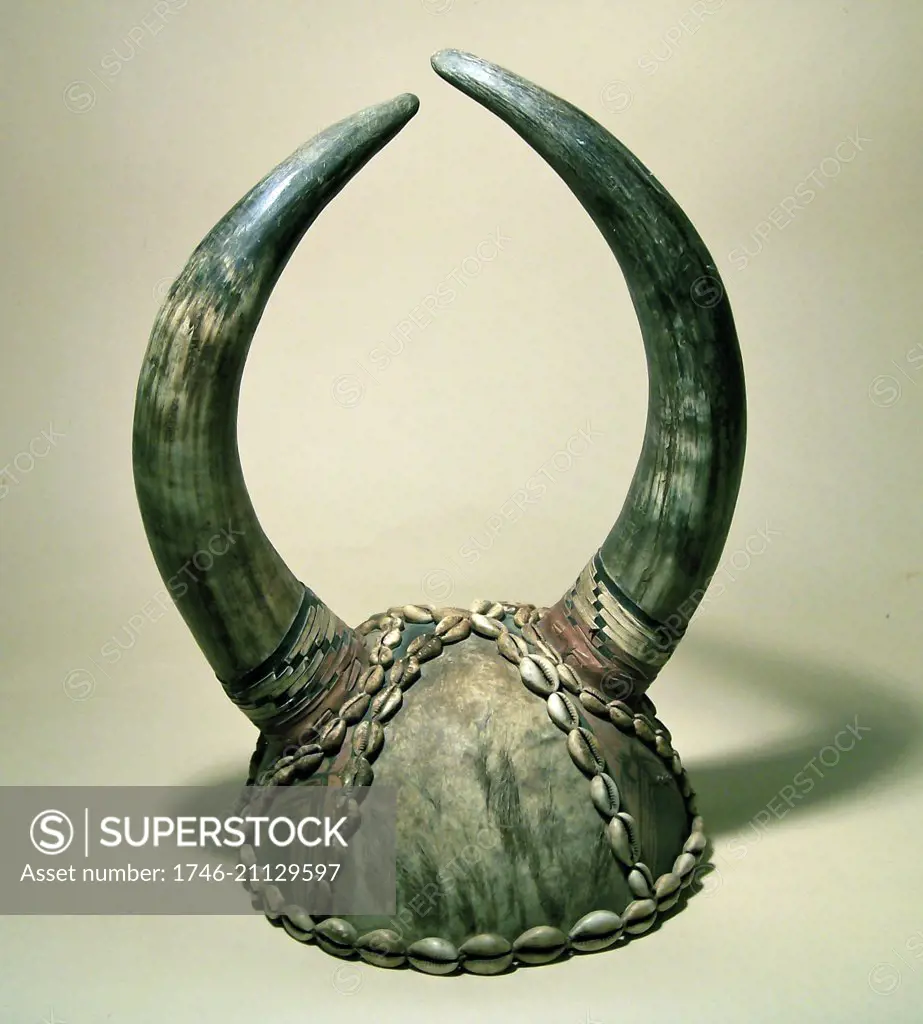 Nigerian horned helmet, decorated with cowrie shells.