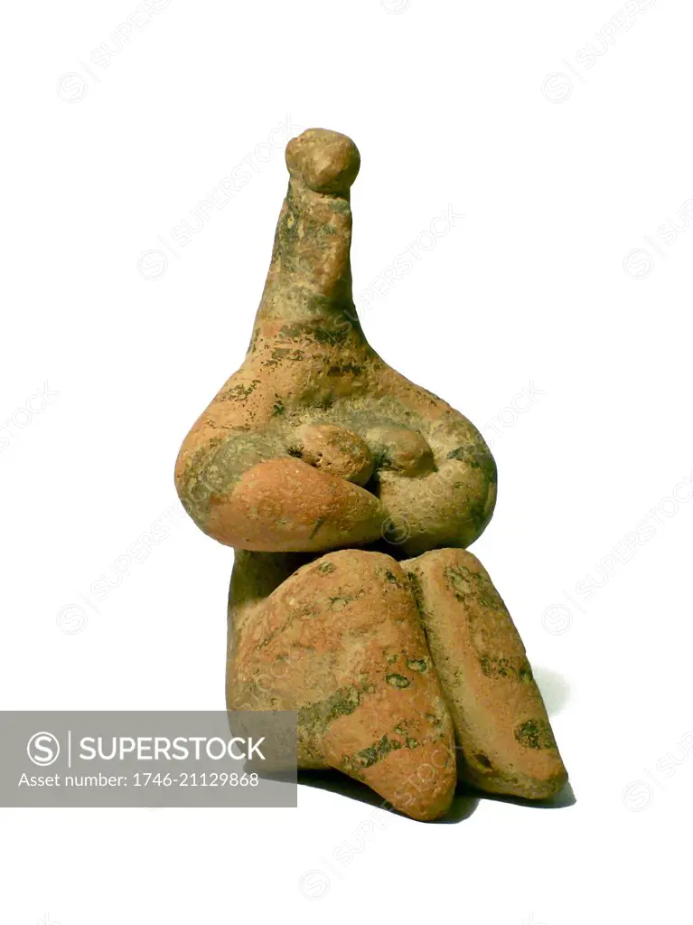 Ancient art: Seated female terracotta figurine, from Tell Halaf, in northeastern Syria, 7500 - 8500 BC. A fertility symbol, with hands clasped to breasts.