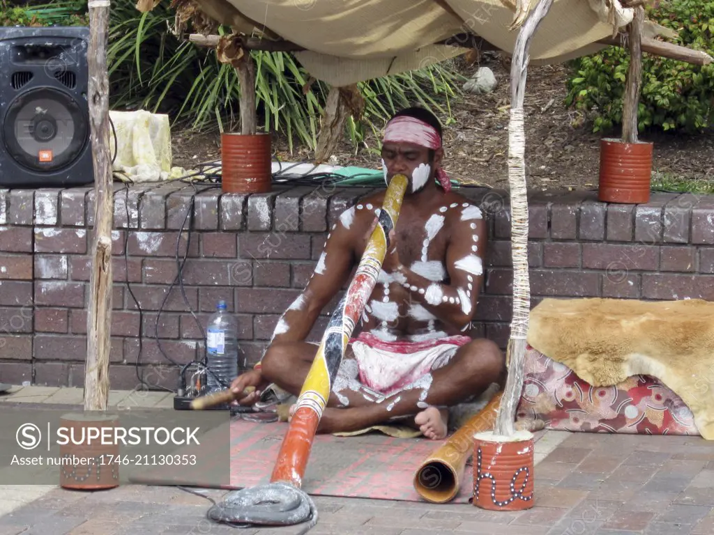 Aboriginal performer, playing the didgeridoo. The Rocks, Sydney harbour, Australia. 2009.