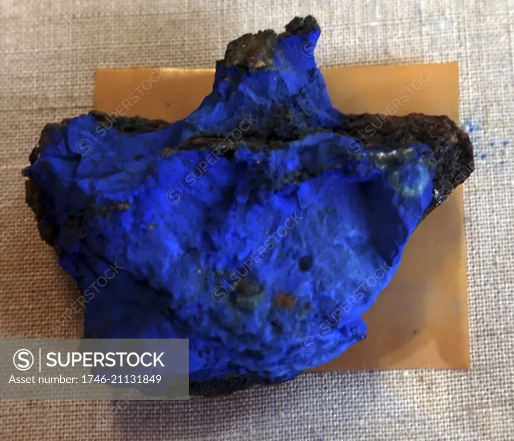 A sample of Azurite, a blue mineral consisting of basic copper carbonate. It occurs as blue prisms or crystal masses, typically with malachite. Dated 20th Century