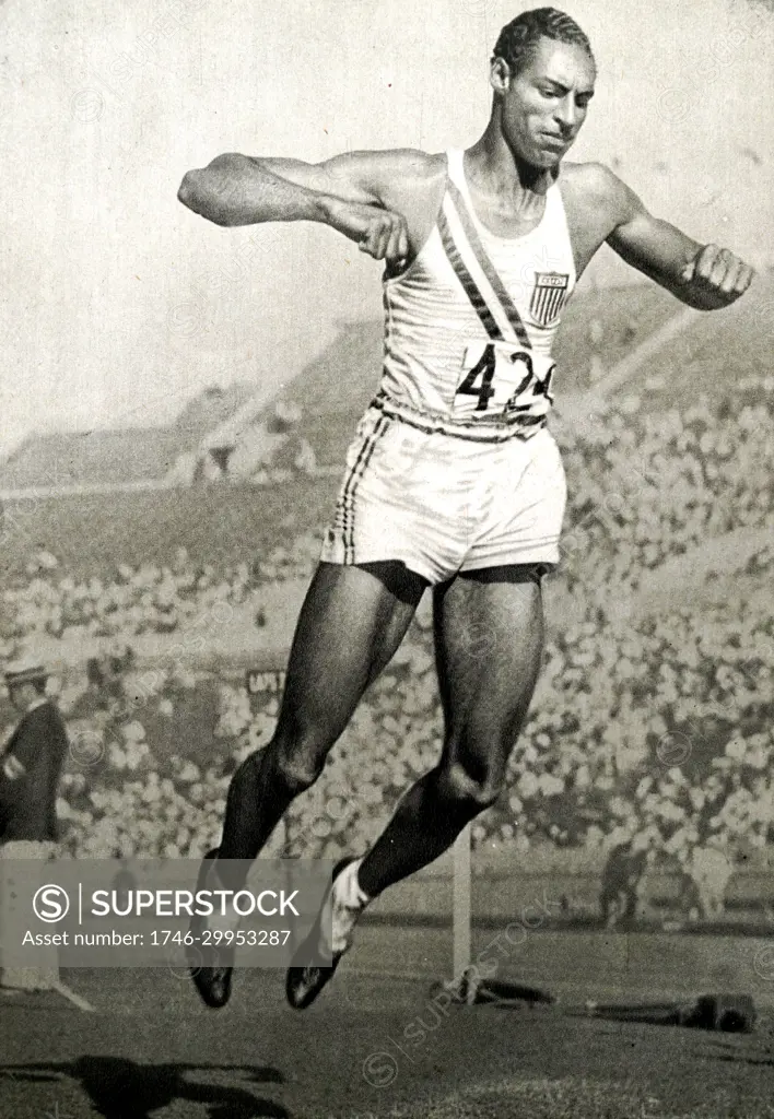 Photograph of Edward Lansing "Ed" Gordon, Jr. (1908 - 1971) competing in the long jump during the 1932 Olympic games. Edward won Gold jumping 7.64 meters. 