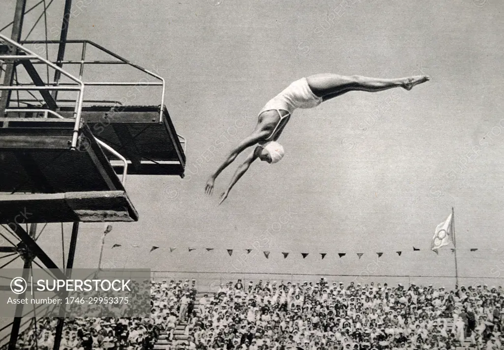 Photograph of Jane Fauntz (1910 - 1989) competing in the springboard diving event at the 1932 Olympic games. She took home the bronze medal for the USA in the event. 