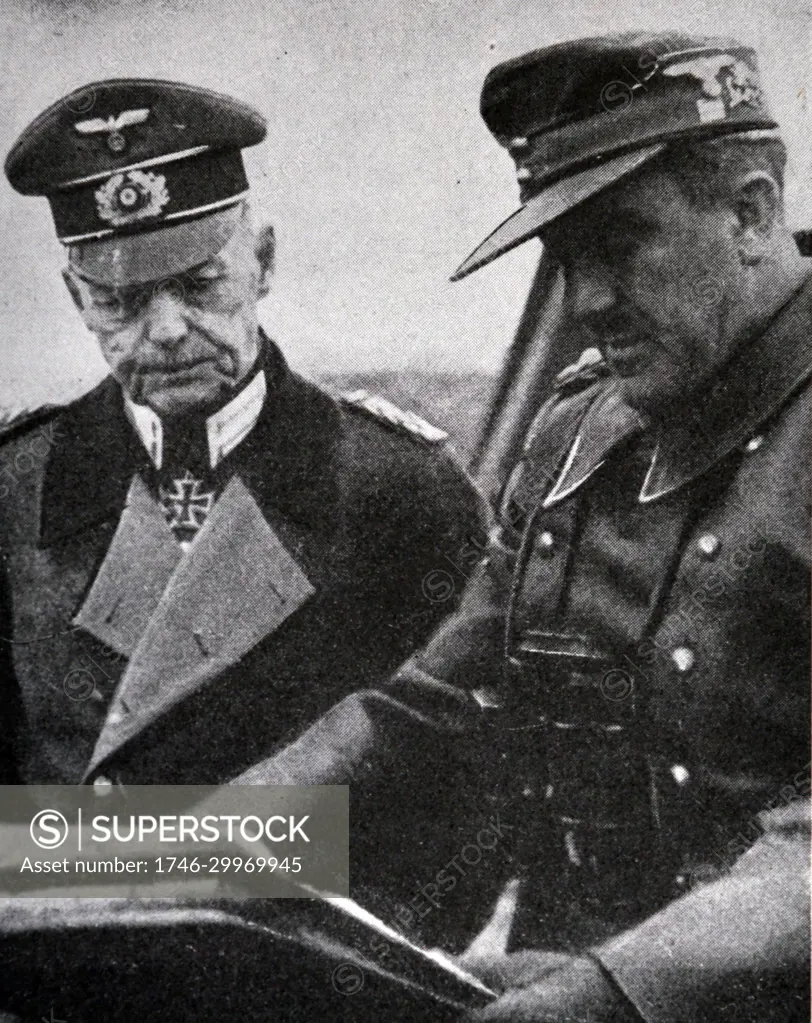 Black and white photograph of World War II (1939-1945); German General Gerd von Rundstedt (1875-1953), commander of the Armies of the South, studies a map before the Battle of Lwow in Ukraine.