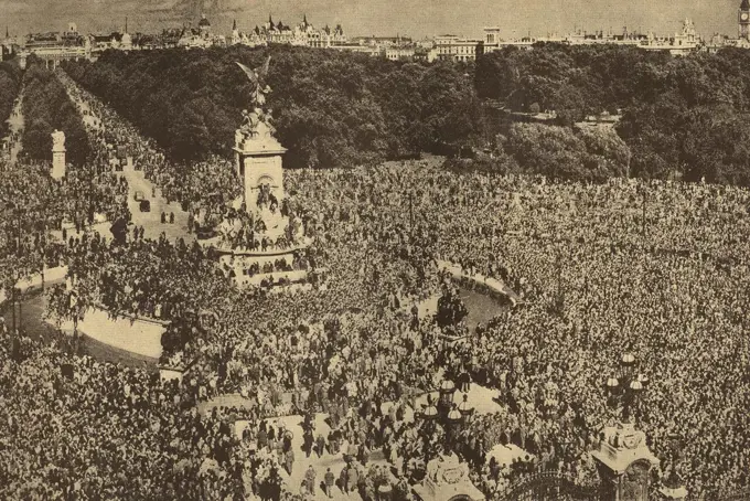 London crowds gather outside Buckingham Palace for VE Day celebrations in May 1945 to mark the end of World War Two in Europe.