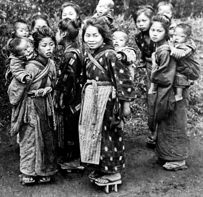 Photograph of a group of Japanese children in traditional costume. Dated 20th Century