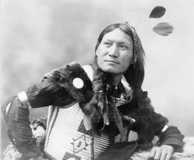 Native North American Indian warrior.  Photograph by Edward Curtis (1868-1952).