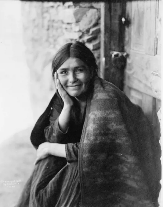 Smiling Native North American Indian woman. Photograph by Edward Curtis (1868-1952).