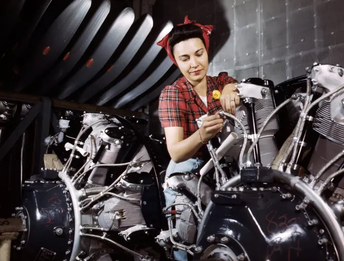 World war two: Women are trained as engine mechanics in thorough Douglas training methods, North American Aviation, Inc Calif.