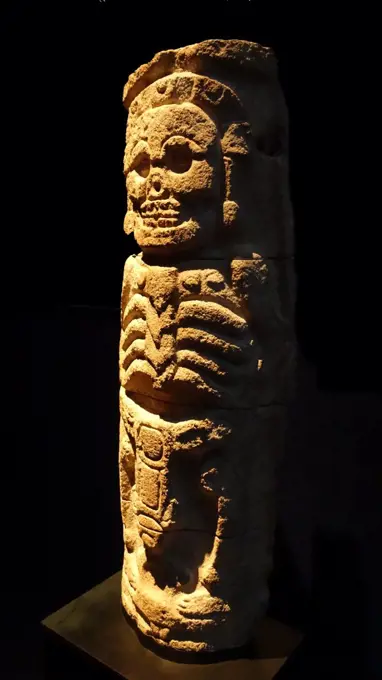Mayan stone relief column, from the Puuc Region, Yucatan, Mexico 800-1000 AD. The god of the underworld is represented as a skeleton with the eyes torn out