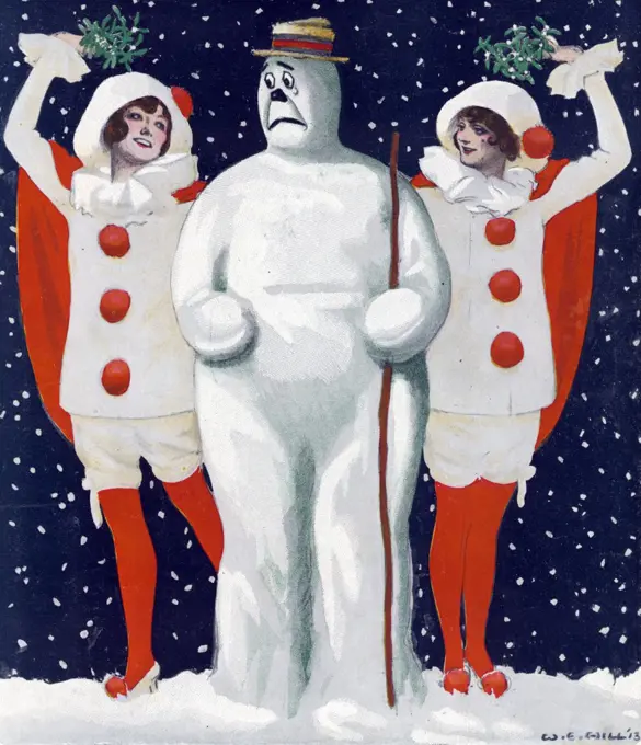 Christmas Puck by artist William Ely Hill (1887-1962). Illustration shows an anxious snowman standing between two beautiful young women wearing clown costumes and holding mistletoe over their heads during an evening snow shower. by Keppler & Schwarzmann in December, 1913.