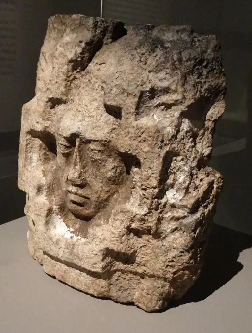 Mayan architectural detail of a face, from a façade in calcified rock. Yucatan, Mexico 600-900 AD