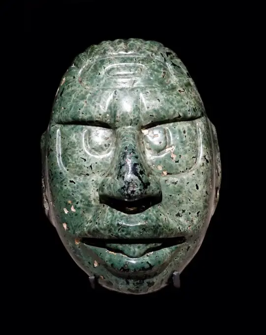 Face of the Mayan Sun God carved in a green stone, 600-900 AD Central American