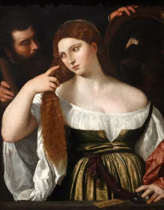 Painting titled 'Girl before the mirror' by Titan, Italian painter, the most important member of the 16th-century Venetian school. Dated 16th Century