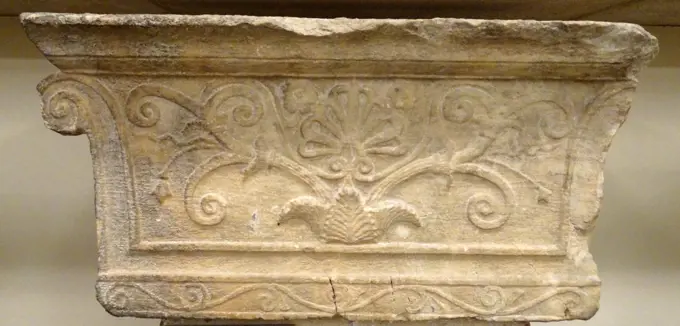Finial of back of a Greek, 3rd century BC, marble bench (exedra) in the form of an Ionic pilaster-capital. An inscription on the return honours Apollonides
