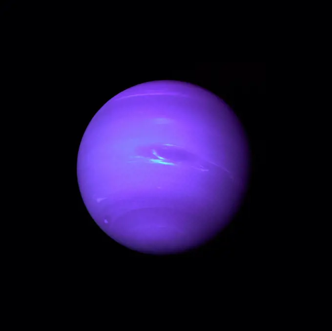 Photograph of the planet Neptune taken through the green and orange filters on the Voyager 2. Dated 1989
