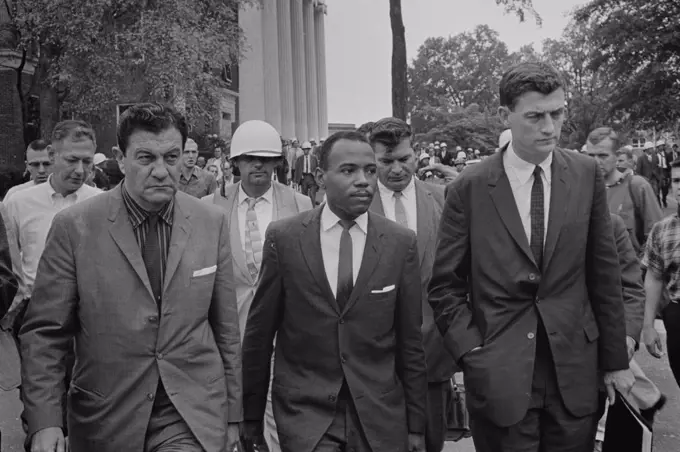James Meredith (African-American student) walking to class following de-segregation, accompanied by U.S. marshals missisippi univ 1968