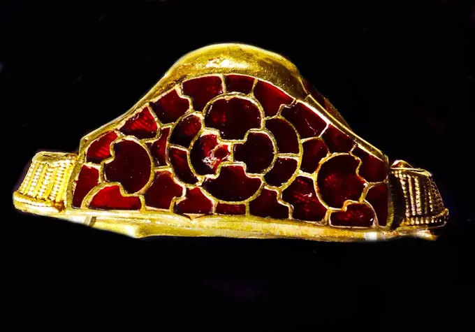 Cloisonné and garnet, decorative gold strip from the Staffordshire Hoard of Anglo-Saxon gold and silver metalwork. Discovered in a field near the village of Hammerwich, near Lichfield, in Staffordshire, England, on 5 July 2009, it consists of over 3,500 items from the Anglo-Saxon kingdom of Mercia.