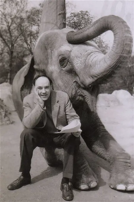 Desmond Morris at the London Zoo with an elephant for Granada TV's Zootime progamme.