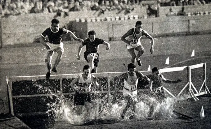 Photograph of the 3000 Meter Steeplechase during the 1932 Olympic games. Won by Volmari Iso-Hollo (1907 - 1969) from Finland. Volmari was one of the last Flying Finns who dominated long distance running. Volmari broke the world record at 09.09.4. 