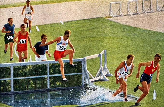 Photograph of Tom Evenson (1910 - 1997) running the 3000 Meter Steeplechase during the 1932 Olympic games. 