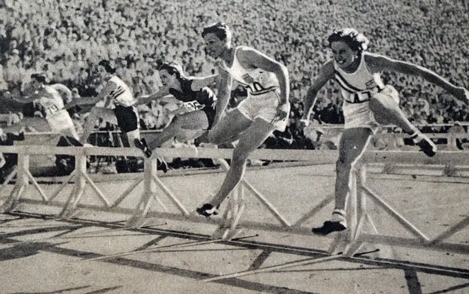 Photograph of Mildred Ella "Babe" Didrikson Zaharias (1911 - 1956) winning the 80m Hurdles at the 1932 Olympic games. Babe gained world fame in track and field and All-American status in basketball.