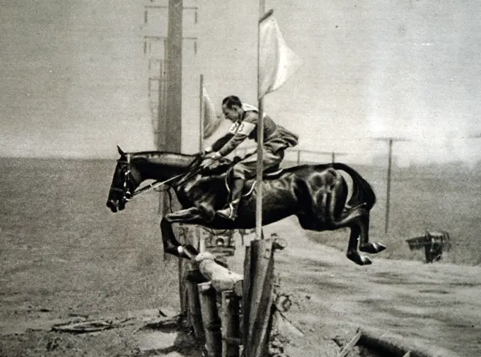 Photograph of Harry Dwight Chamberlin (1887 - 1944) jumping at the 1932 Olympic games. Took silver in the event for the USA. 