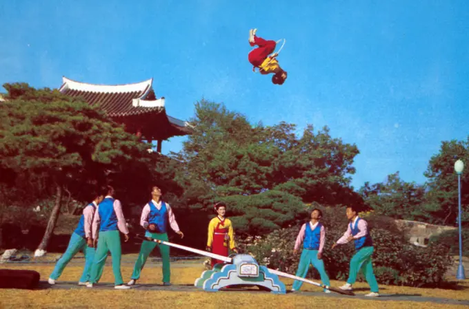 Ethnographic game "Jumping on the board" (from circus performances). North Korea 1986