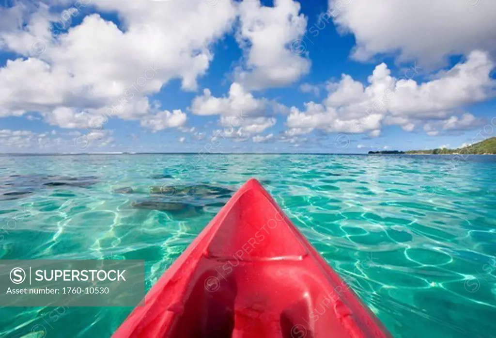 French Polynesia, Tahiti, Bora Bora, Red outrigger canoe in calm turquoise water.