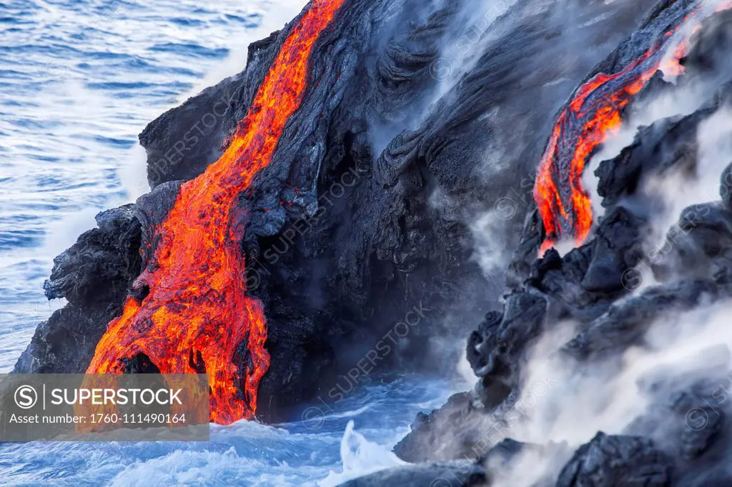 The Pahoehoe lava flowing from Kilauea has reached the Pacific ocean near Kalapana, Big Island; Island of Hawaii, Hawaii, United States of America