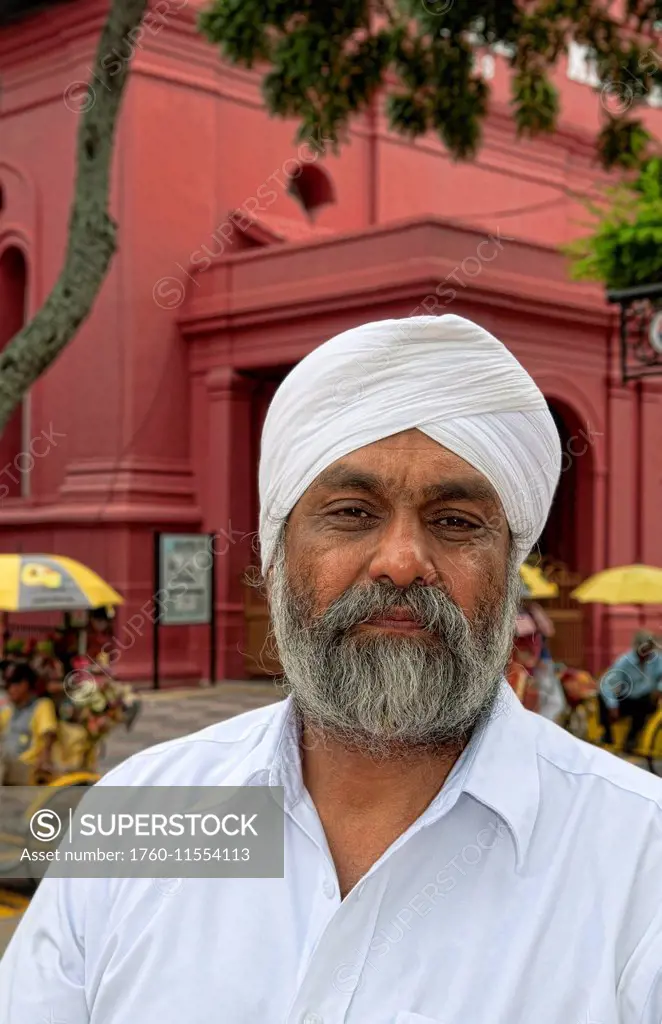 South East Asia, Malaysia, Melaka Aka Heritage City, Portrait Of An Older Bearded Man In Main Square With Artists And Flower Vendors.