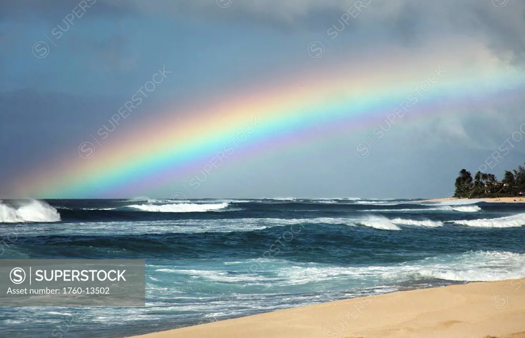 Hawaii, Oahu, North Shore, Rainbow over the ocean.