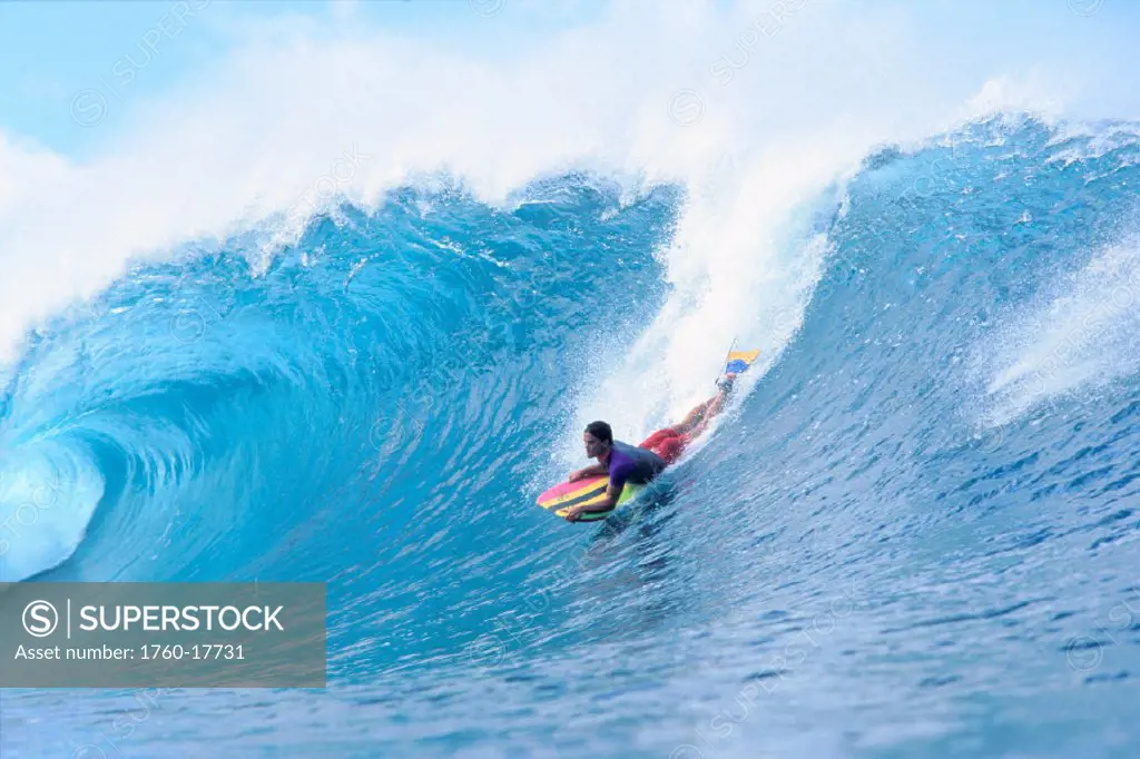 Hawaii, NorthShore Oahu, Body boarder Jack Lindholm riding wave