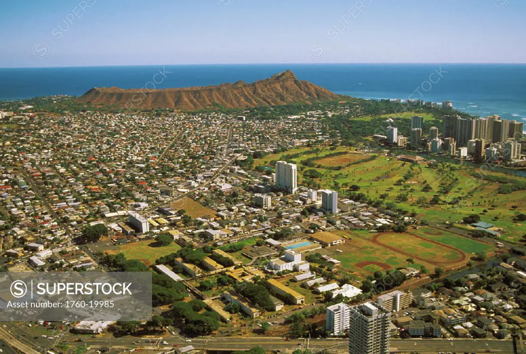 Hawaii, Oahu, Aerial view of neighborhoods surrounding Diamond Head, blue sky